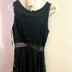 Black knee length dress black with white center strip.